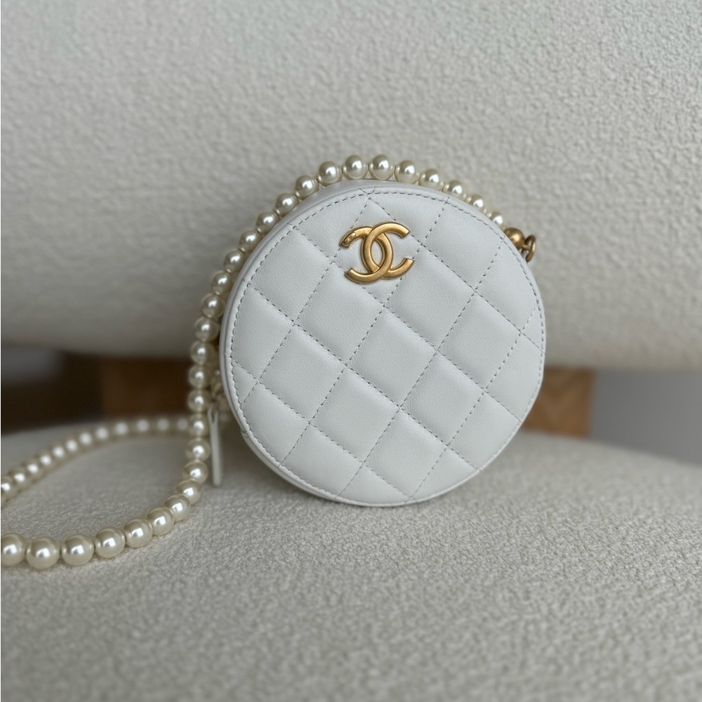 Chanel quilted white round pearl cross body bag